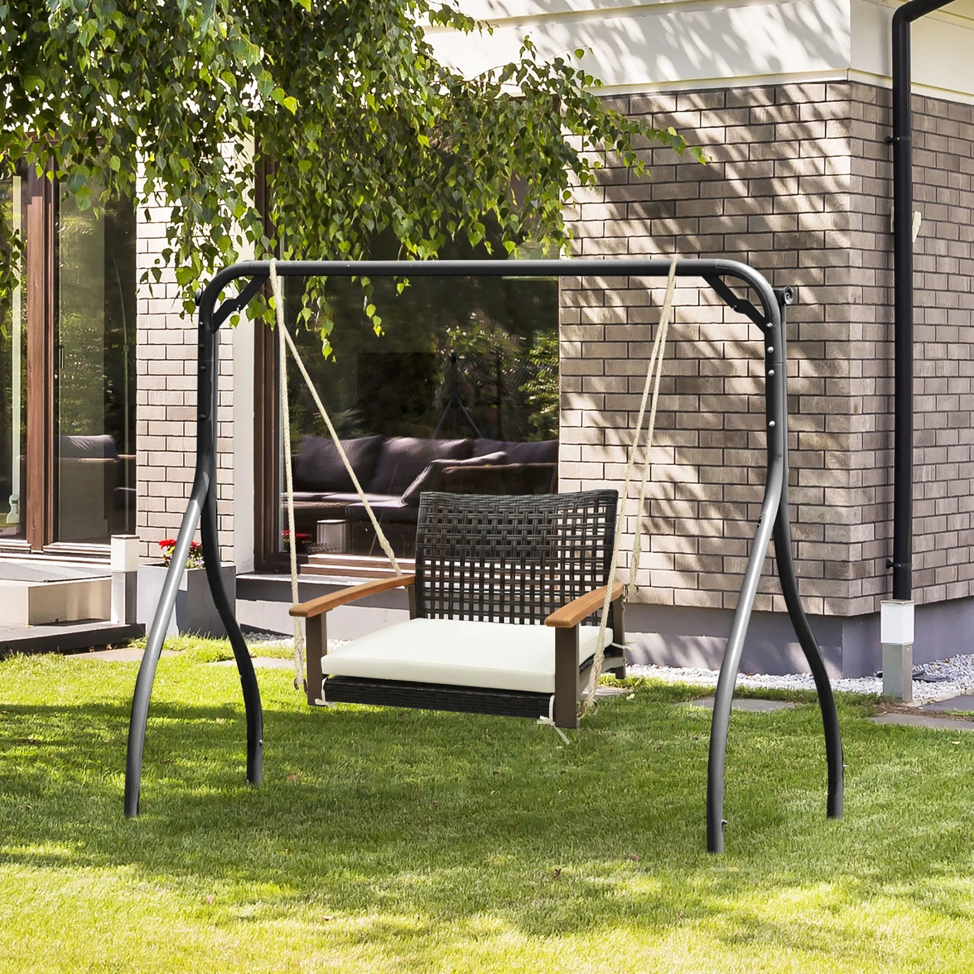 Gymax Rattan Porch Swing Patio Wicker Single Hanging Seat w/Seat Cushion & Acacia Wood Armrests